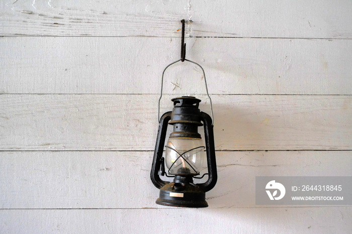 Old lamp on the wall in the barn, Texas, US