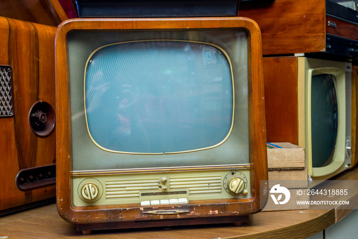 Ancient old television set show in the electrical stores. Old vintage television set