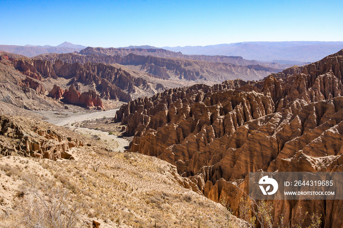 A remote road winds through the desert landscape of Bolivia between Tupiza and Salar de Uyuni