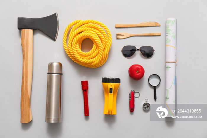 Set of items for hiking on light background