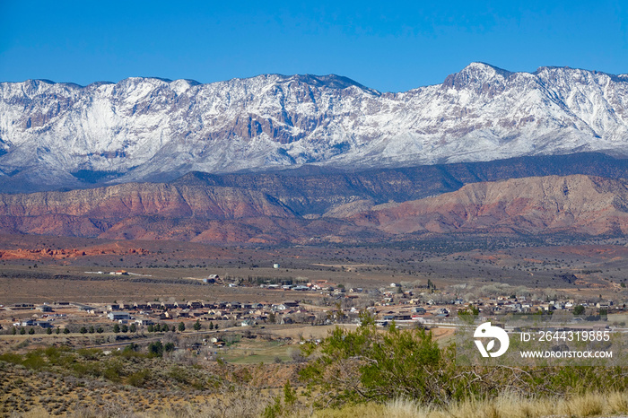 Scenic shot of a small village under the breathtaking ridge in United States.