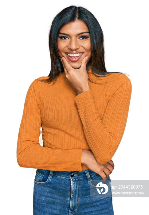 Young latin transsexual transgender woman wearing casual clothes looking confident at the camera smiling with crossed arms and hand raised on chin. thinking positive.