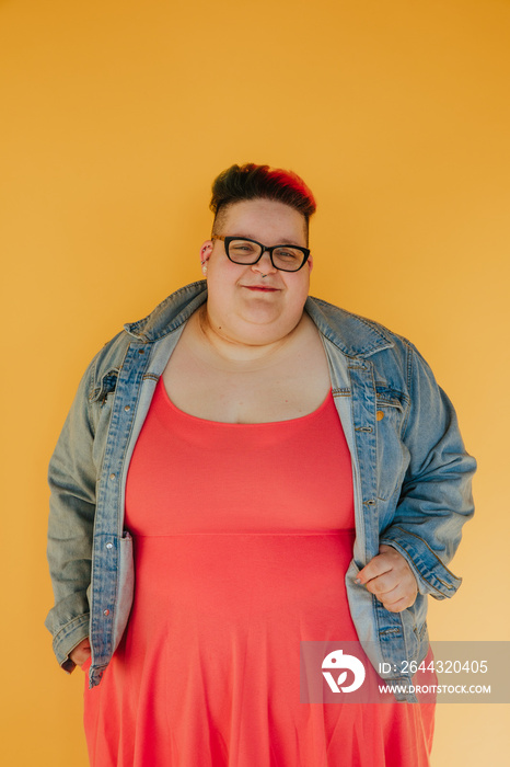 portrait of a plus size woman with a denim jacket