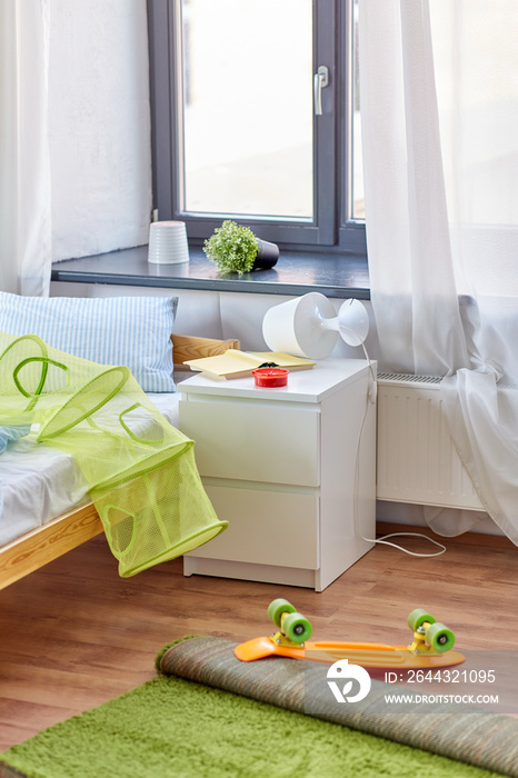 mess, disorder and interior concept - view of messy home kid’s room with scattered stuff