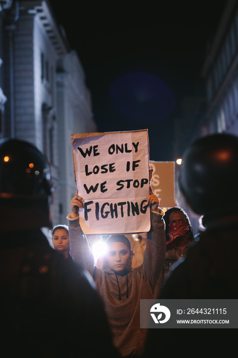 Group of demonstrators in front of police force