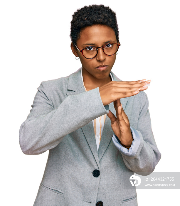 Young african american woman wearing business clothes doing time out gesture with hands, frustrated and serious face