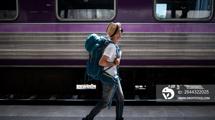 Traveler waits train at train station