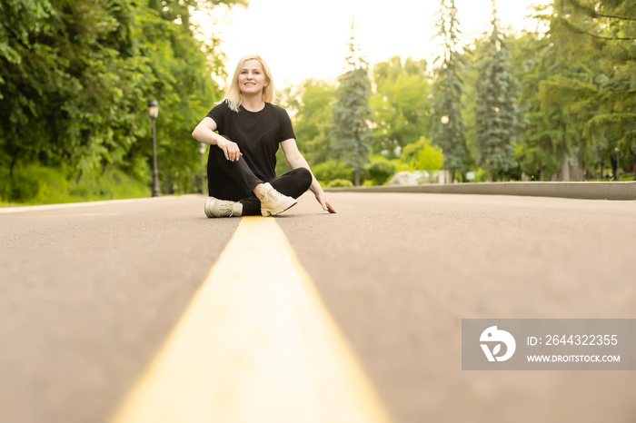 Woman walking along a country road