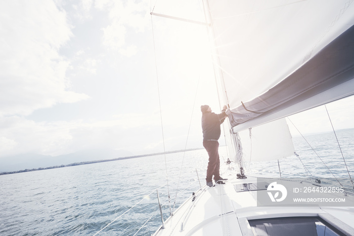 Aged man on sailboat