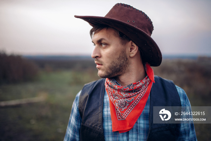 Portrait of cowboy in leather jacket and hat