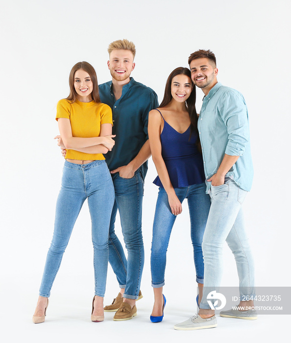 Group of young people in stylish casual clothes on white background