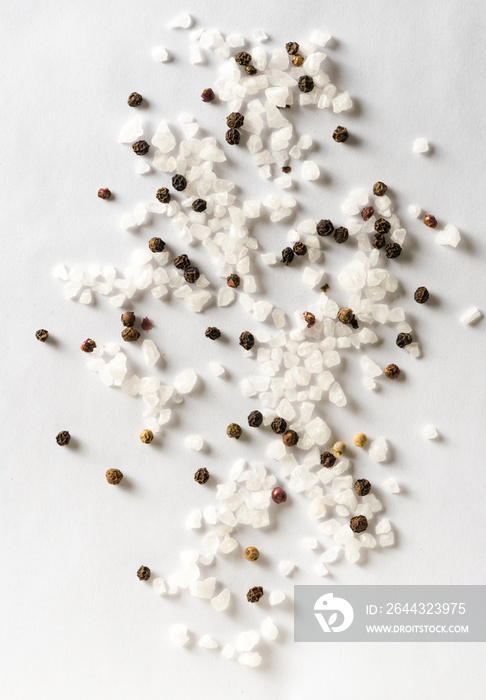 Salt and mix of pepper on white background. Top view.