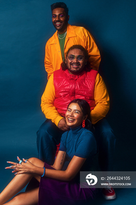 Asian trio colour blocked fashion studio portrait