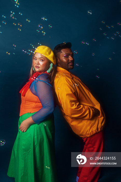 Asian duo fashion colour-blocked studio portrait