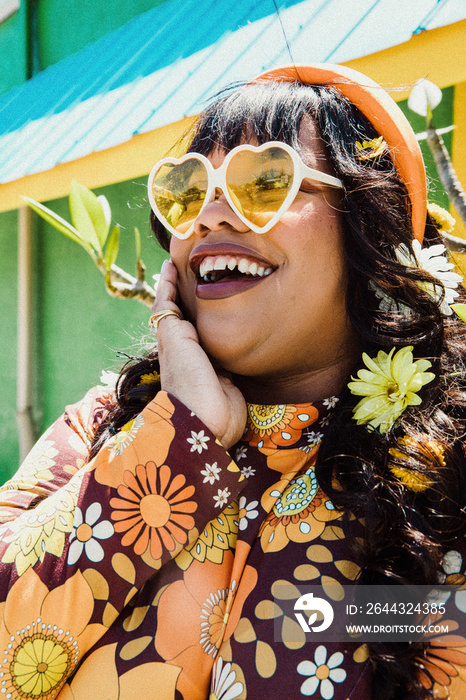 closeup of a plus size Black woman wearing heart sunglasses