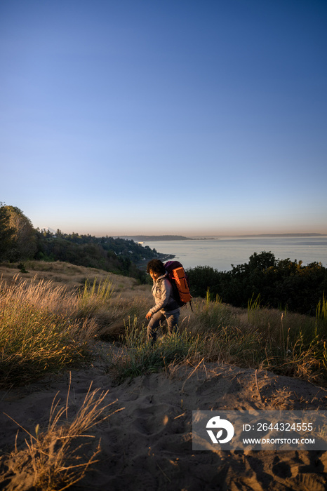 U.S. Army female soldier putting in the miles with an early morning hike in the NorthWest.