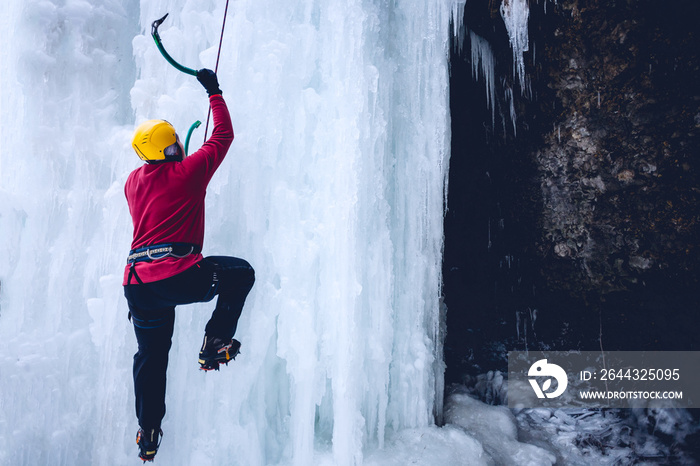 climber climbs on the ice