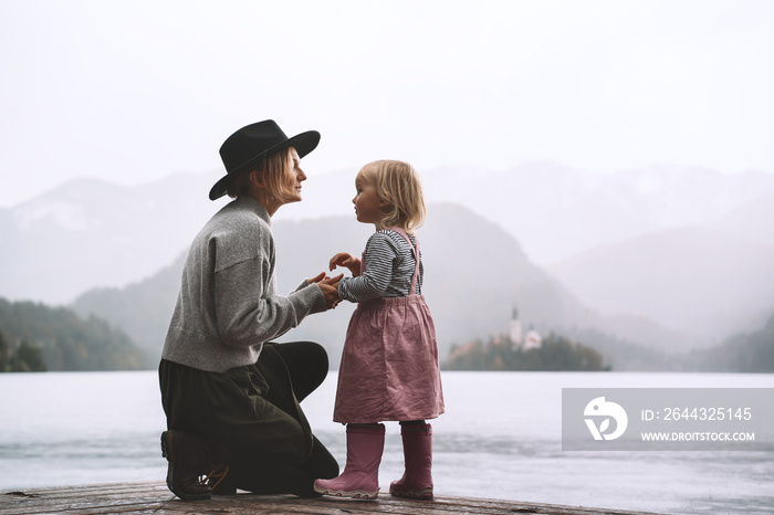 Mother and daughter looking at beautiful Lake Bled.