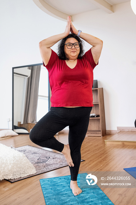 Group of friends meditating and doing yoga at home