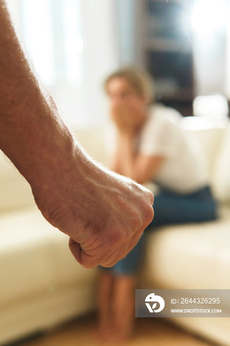 Male fist and victim of domestic violence.