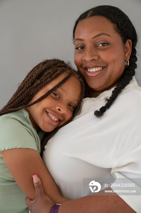 Daughter (6-7) embracing mother