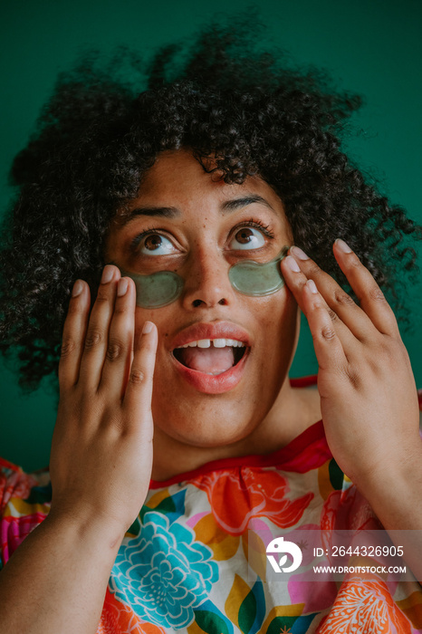 closeup of a plus size black person using eye pads