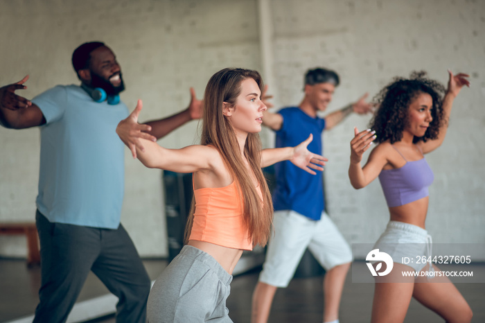 Group of people learning to dance jazz-funk