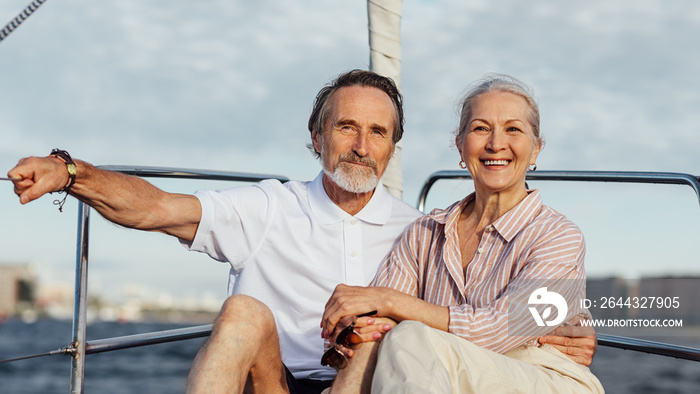 Senior couple enjoying quality time on sailing trip on a private yacht