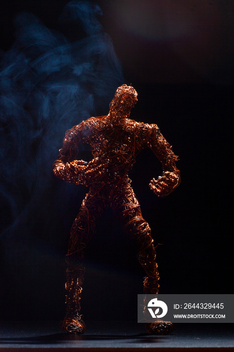 painful metal wire man in smoke