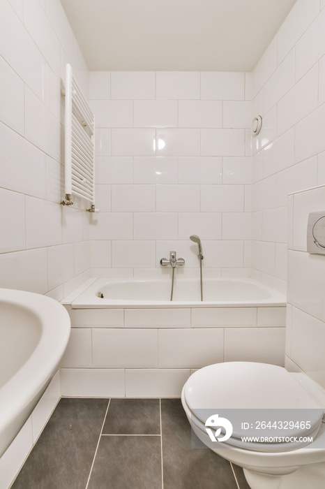 Stunning bathroom with black tiled floor and white walls