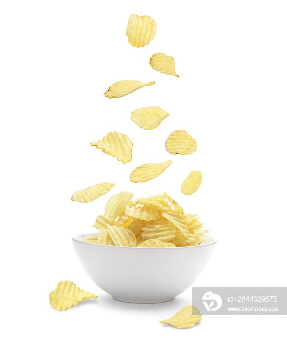 Potato chips falling in the faience white bowl. Isolated on whit