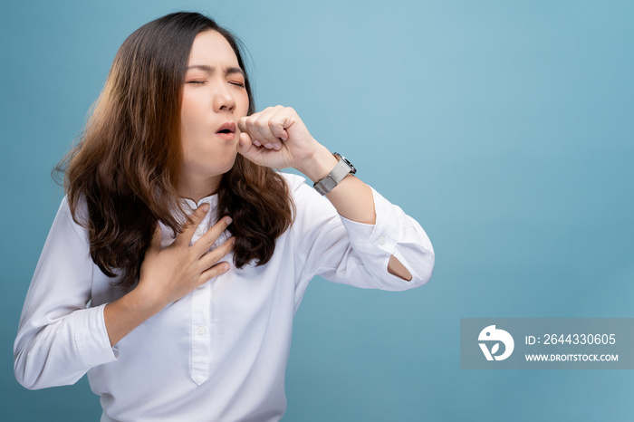 Woman has sore throat isolated over blue background