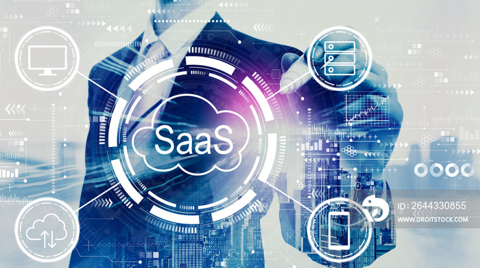 SaaS - software as a service concept with businessman on a city background