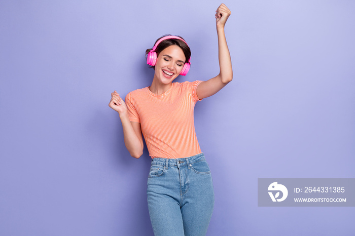 Photo of positive cheerful lady dressed striped stylish clothes eyes closed listen playlist melody isolated on purple color background