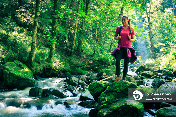 Young Woman Hiking In The Forest