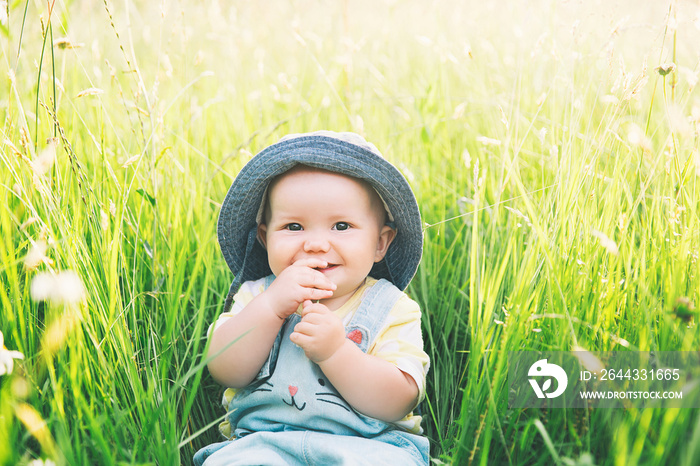 Baby on nature at summertime.