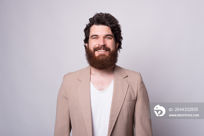 Simple front portrait of a bearded man over white background like for id card or passport