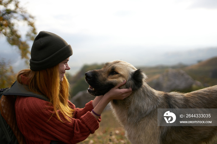 woman playing with dog outdoors travel friendship together