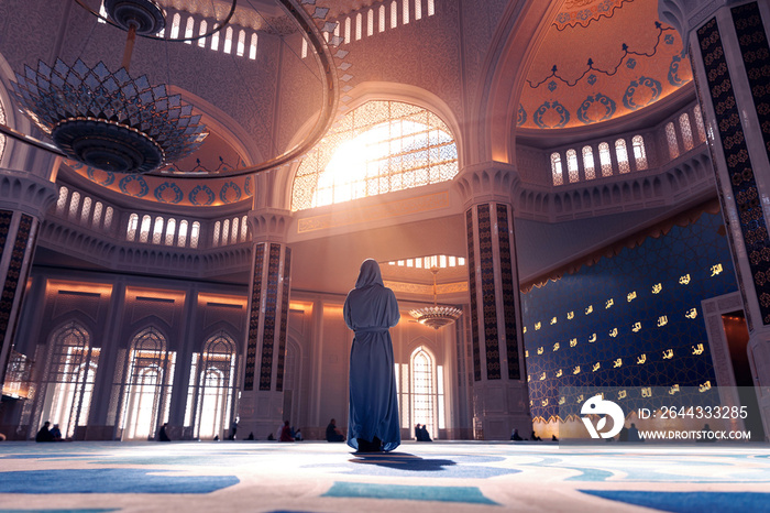 Back view modern woman in traditional blue abaya standing in Grand Mosque with magic sun light. Concept traveling islam arab culture