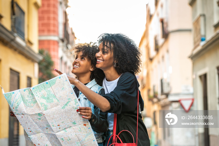 Mother and Daughter Using a Map in the Street.