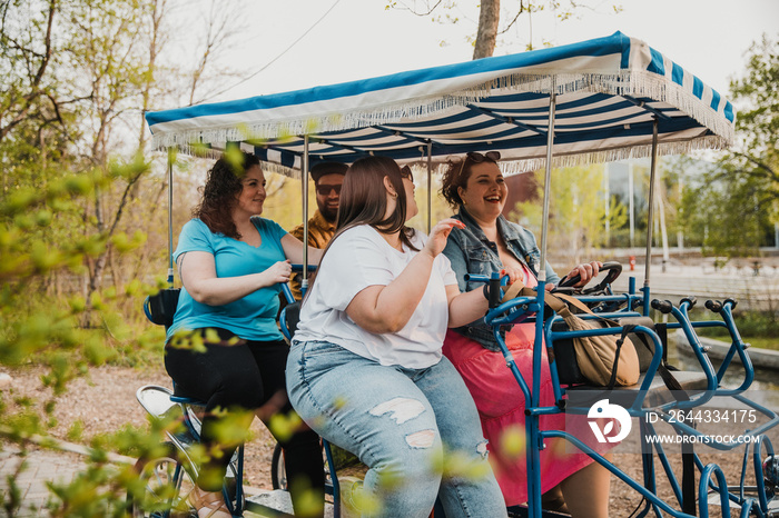 group of friends ride bike in the park