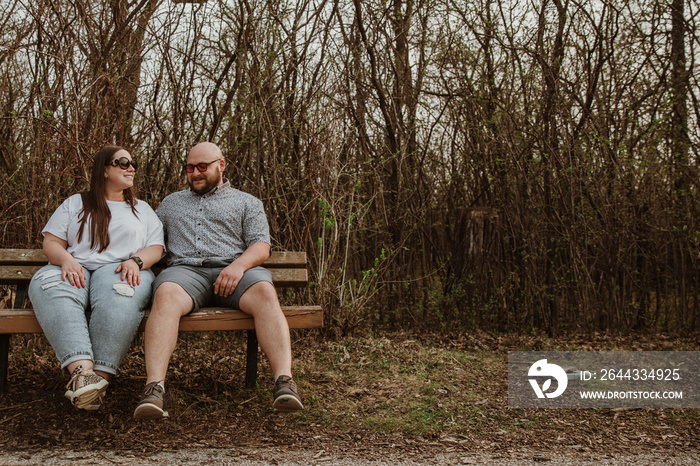 couple sitting on bench