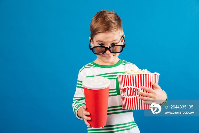 Smiling young preparing to watch film and looking over eyeglasses