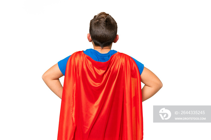 Little caucasian kid over isolated chroma key background in superhero costume in back position