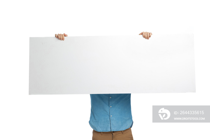 man in jeans shirt covering face with long empty board