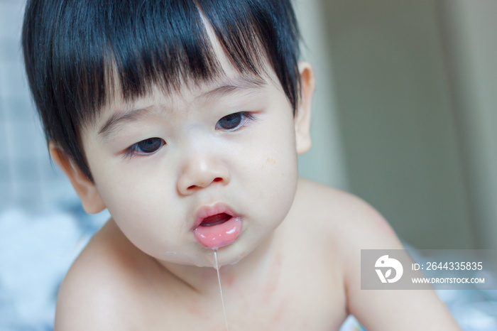 Asian baby drooling isolated on white background