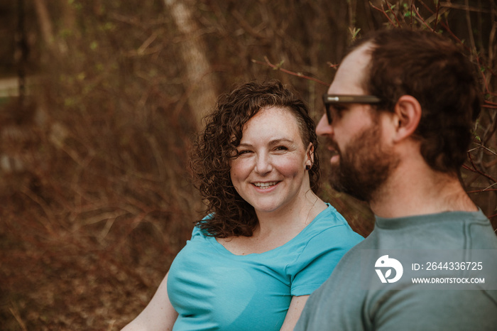 woman laughing while looking at man