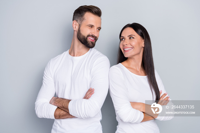 Photo of confident cheerful young brother sister dressed white shirts arms folded looking eyes isolated grey color background