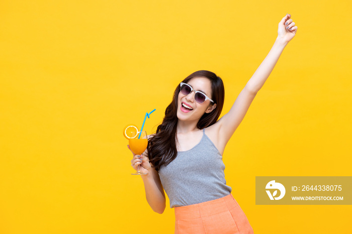 Happy woman in summer casual clothes with glass of fruit juice drink