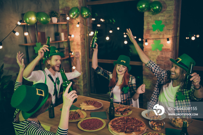 Close up photo people two couples green beverage hold in air hats leaf eat food pizza sausage chips leprechaun costumes checkered plaid shirt rest relax together weekend vacation free time leisure